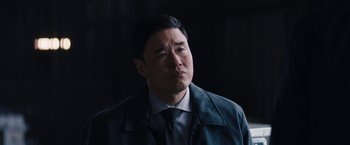 Movie still from “WandaVision” (2021), directed by Matt Shakman – A person wearing a suit and tie; Close Up shot, Over the shoulder angle