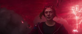 Movie still from “WandaVision” (2021), directed by Matt Shakman – A woman wearing a red headband with horns on her head; Close Up shot, Overhead angle