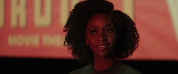 Movie still from “WandaVision” (2021), directed by Matt Shakman – A person wearing a black shirt; Close Up shot, Over the shoulder angle