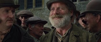 Movie still from “War Horse” (2011), directed by Steven Spielberg – A man with a long beard wearing a hat; Close Up shot, Low angle