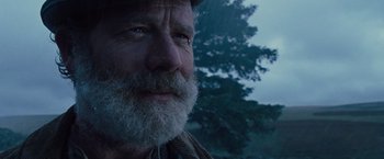 Movie still from “War Horse” (2011), directed by Steven Spielberg – An old man with a beard and a hat; Close Up shot, Low angle