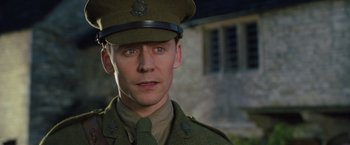 Movie still from “War Horse” (2011), directed by Steven Spielberg – A person wearing a uniform; Close Up shot, Over the shoulder angle