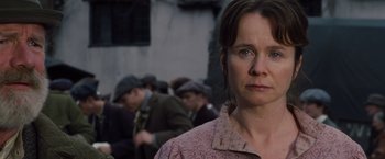 Movie still from “War Horse” (2011), directed by Steven Spielberg – A person with a crowd in the background; Close Up shot, Low angle