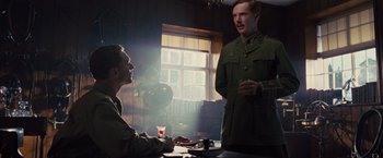 Movie still from “War Horse” (2011), directed by Steven Spielberg – A man in a uniform talking to another man in a uniform; Medium shot, Low angle