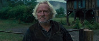 Movie still from “War Horse” (2011), directed by Steven Spielberg – An older man with white hair is looking at the camera; Close Up shot, Low angle