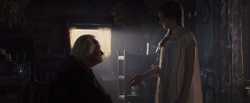 Movie still from “War Horse” (2011), directed by Steven Spielberg – An old man and a young girl in a room; Medium shot, Over the shoulder angle