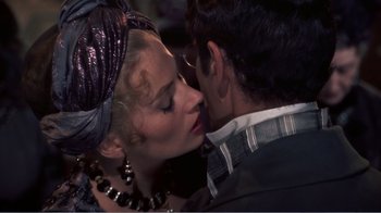 Movie still from “War and Peace” (1956), directed by King Vidor – A man and a woman kissing each other in front of a mirror; Close Up shot, Over the shoulder angle