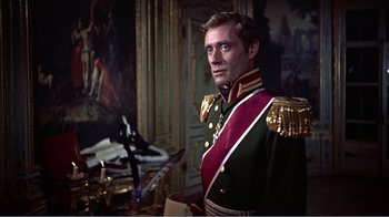 Movie still from “War and Peace” (1956), directed by King Vidor – A man in a military uniform standing in front of a painting; Medium shot, Low angle
