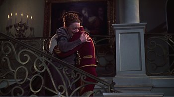 Movie still from “War and Peace” (1956), directed by King Vidor – A woman hugging another woman on the stairs; Wide shot, High angle