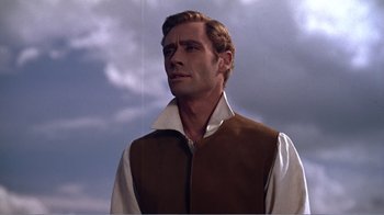 Movie still from “War and Peace” (1956), directed by King Vidor – A person wearing a shirt and a vest; Close Up shot, Low angle
