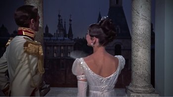 Movie still from “War and Peace” (1956), directed by King Vidor – A woman in a white dress looking out at a castle; Medium shot, Low angle