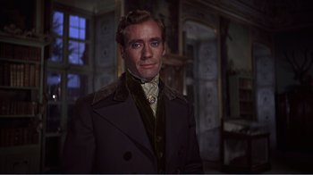 Movie still from “War and Peace” (1956), directed by King Vidor – A person wearing a suit and tie; Medium shot, Low angle