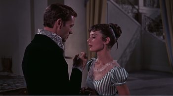 Movie still from “War and Peace” (1956), directed by King Vidor – A man and a woman are standing next to each other; Medium shot, Over the shoulder angle
