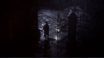 Movie still from “War and Peace” (1956), directed by King Vidor – A man standing in the middle of a dark street; Wide shot, High angle
