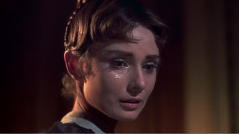 Movie still from “War and Peace” (1956), directed by King Vidor – A person with a tear in her eye; Close Up shot, Low angle