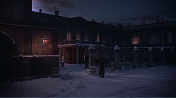 Movie still from “War and Peace” (1956), directed by King Vidor – A person standing in the middle of a snow covered street; Extreme Wide shot, High angle