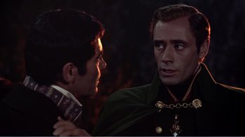 Movie still from “War and Peace” (1956), directed by King Vidor – Two men are talking to each other in the dark; Close Up shot, Over the shoulder angle