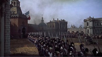 Movie still from “War and Peace” (1956), directed by King Vidor – A large group of men in medieval garb marching in a field; Extreme Wide shot, High angle
