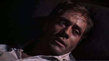Movie still from “War and Peace” (1956), directed by King Vidor – A person wearing a white shirt; Close Up shot, High angle