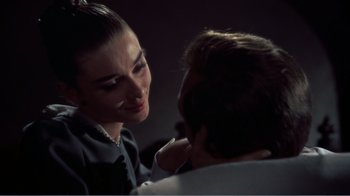 Movie still from “War and Peace” (1956), directed by King Vidor – A man and a woman talking to each other; Close Up shot, Over the shoulder angle