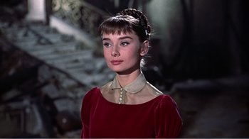 Movie still from “War and Peace” (1956), directed by King Vidor – A woman in a red dress with a white collar; Close Up shot, Low angle