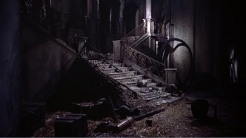 Movie still from “War and Peace” (1956), directed by King Vidor – The stairs of a very old building have been destroyed; Wide shot, High angle