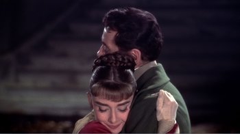 Movie still from “War and Peace” (1956), directed by King Vidor – A man and a woman are hugging each other; Close Up shot, High angle