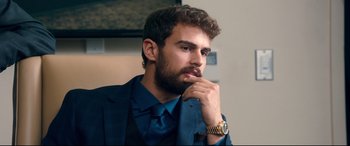 Movie still from “War on Everyone” (2016), directed by John Michael McDonagh – A man in a blue suit and a blue tie; Close Up shot, Over the shoulder angle