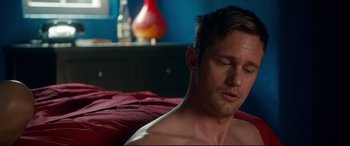 Movie still from “War on Everyone” (2016), directed by John Michael McDonagh – A man laying on a bed with his eyes closed; Close Up shot, High angle