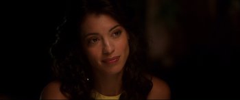 Movie still from “War on Everyone” (2016), directed by John Michael McDonagh – A woman's face in the dark; Close Up shot, Over the shoulder angle