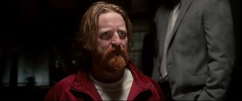 Movie still from “War on Everyone” (2016), directed by John Michael McDonagh – A person with a beard; Close Up shot, Low angle