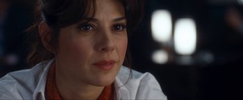 Movie still from “War, Inc.” (2008), directed by Joshua Seftel – A person wearing a white shirt; Close Up shot, Over the shoulder angle