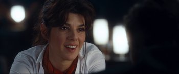 Movie still from “War, Inc.” (2008), directed by Joshua Seftel – A person wearing a white shirt; Close Up shot, Over the shoulder angle