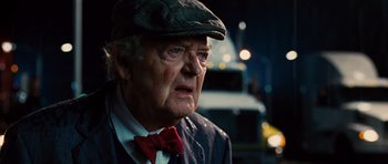 Movie still from “Water for Elephants” (2011), directed by Francis Lawrence – An old man wearing a hat and a bow tie; Close Up shot, Over the shoulder angle