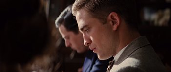Movie still from “Water for Elephants” (2011), directed by Francis Lawrence – Two men sitting side by side in a room; Close Up shot, Over the shoulder angle