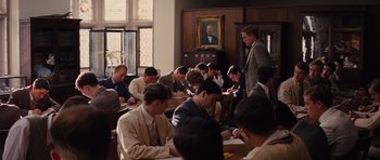 Movie still from “Water for Elephants” (2011), directed by Francis Lawrence – A group of men sitting at a table in a room; Wide shot, High angle