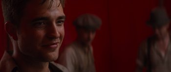 Movie still from “Water for Elephants” (2011), directed by Francis Lawrence – A person with a hat on; Close Up shot, Over the shoulder angle
