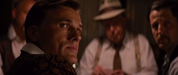 Movie still from “Water for Elephants” (2011), directed by Francis Lawrence – A man in a hat and a man in a tie; Close Up shot, Over the shoulder angle