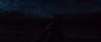 Movie still from “Water for Elephants” (2011), directed by Francis Lawrence – A train traveling down the tracks in the dark; Extreme Wide shot, High angle