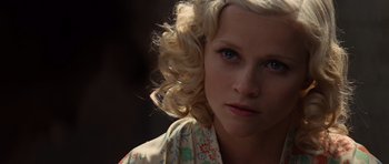 Movie still from “Water for Elephants” (2011), directed by Francis Lawrence – A person with blonde curly hair; Close Up shot, Low angle