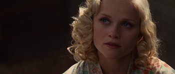 Movie still from “Water for Elephants” (2011), directed by Francis Lawrence – A person with blonde curly hair; Close Up shot, Over the shoulder angle