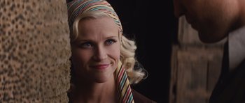 Movie still from “Water for Elephants” (2011), directed by Francis Lawrence – A woman with blonde curly hair wearing a colorful scarf; Close Up shot, Over the shoulder angle