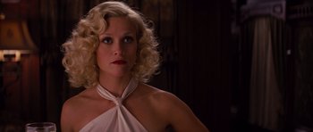 Movie still from “Water for Elephants” (2011), directed by Francis Lawrence – A woman with blonde curly hair wearing a white dress; Close Up shot, Low angle