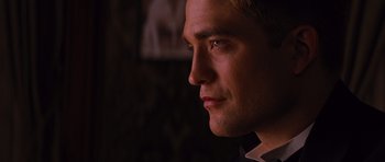 Movie still from “Water for Elephants” (2011), directed by Francis Lawrence – A man's face in the dark; Close Up shot, Over the shoulder angle