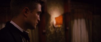 Movie still from “Water for Elephants” (2011), directed by Francis Lawrence – A man's face in a dark room; Close Up shot, Over the shoulder angle