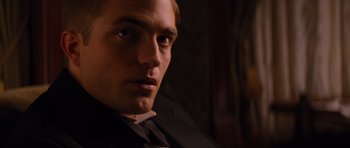 Movie still from “Water for Elephants” (2011), directed by Francis Lawrence – A person wearing a suit and tie; Close Up shot, Over the shoulder angle