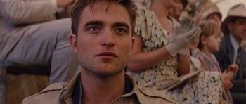 Movie still from “Water for Elephants” (2011), directed by Francis Lawrence – A person wearing a jacket; Close Up shot, Over the shoulder angle