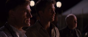Movie still from “Water for Elephants” (2011), directed by Francis Lawrence – A couple of men standing next to each other; Close Up shot, Over the shoulder angle