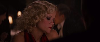 Movie still from “Water for Elephants” (2011), directed by Francis Lawrence – A woman with blonde curly hair sitting next to a man; Close Up shot, Over the shoulder angle