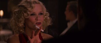 Movie still from “Water for Elephants” (2011), directed by Francis Lawrence – A woman smoking a cigarette in front of a man; Close Up shot, Over the shoulder angle